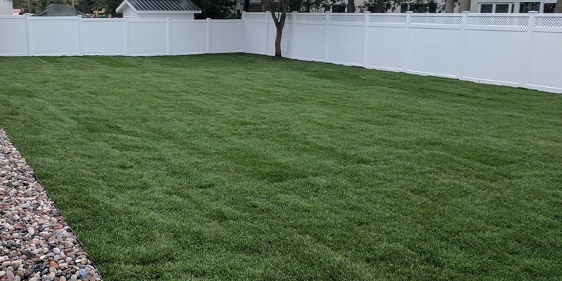 grading%20and%20laying%20green%20new%20sod%20in%20back%20lawn%20white%20fence%20ottawa