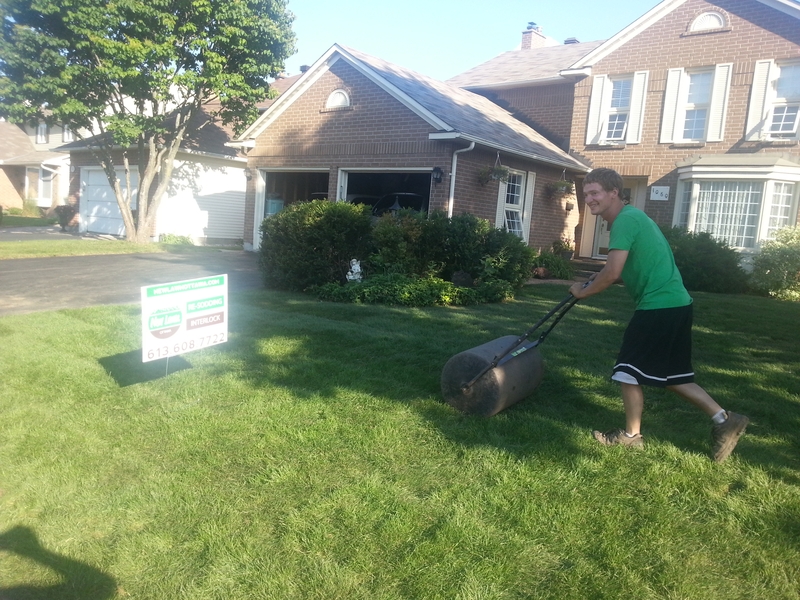 michael%20rolling%20new%20sod%20front%20lawn