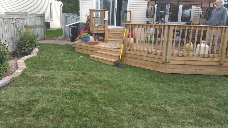 re-sodded%20small%20back%20lawn%20with%20wood%20deck