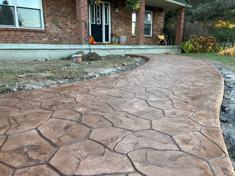 stamped-concrete-walkway-random-stone-brown-red-5