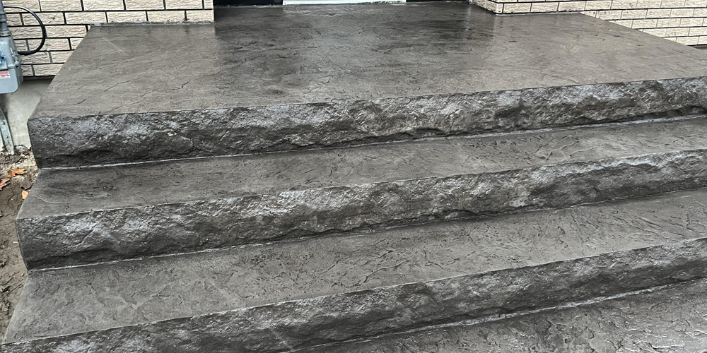 white-and-grey-stamped-concrete-front-walkway