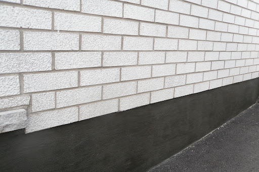 black parging on foundation wall