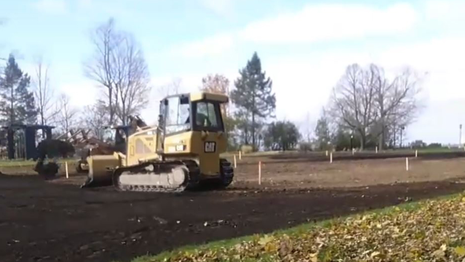 bulldozer grading soil for new lawn