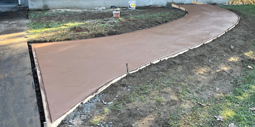 spreading concrete release powder on slab