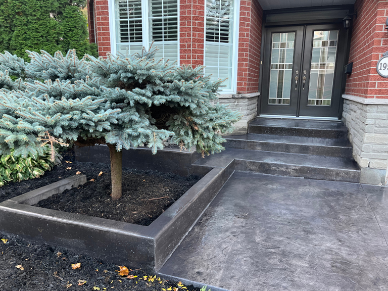 stamped concrete steps and garden wall in smoke grey with slate texture stamp