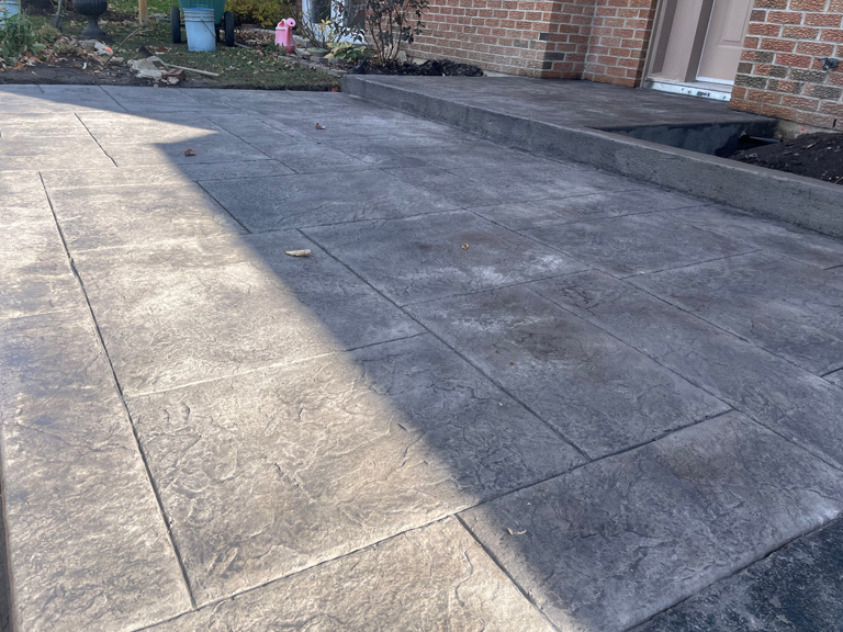 stamped concrete walkway ashlar slate in smoke grey close up