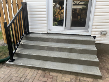 broom finished concrete step and railing